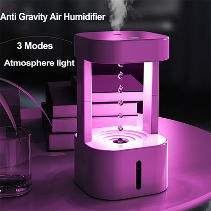 Anti-gravity water drop humidifier with 3 modes and atmosphere light, 580ml tank in a bedroom setting.