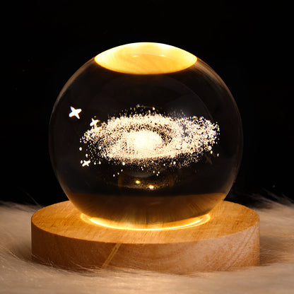 LED night light galaxy crystal ball lamp with 3D galaxy design glowing on wooden base, perfect for home decor and gifts.