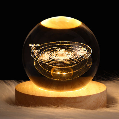 3D Galaxy Crystal Ball LED Lamp displaying solar system on a wooden base, perfect for home decor and kids' gifts.