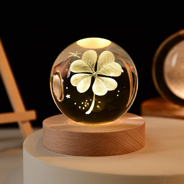 LED night light crystal ball with clover design on wooden base, perfect for bedroom decor and kids' parties.